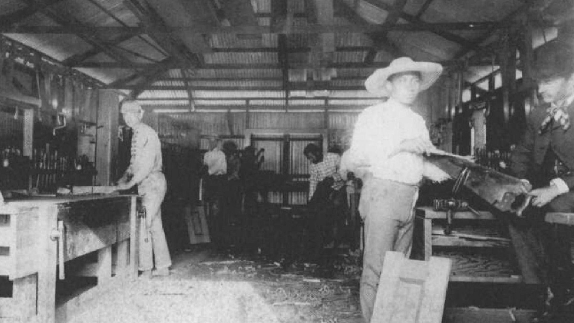 Students working in the Carpentry Shop, Kamehameha School for Boys, 1890, (right) Rev. Wm. Oleson, Principal, (far left) Charles E. King.