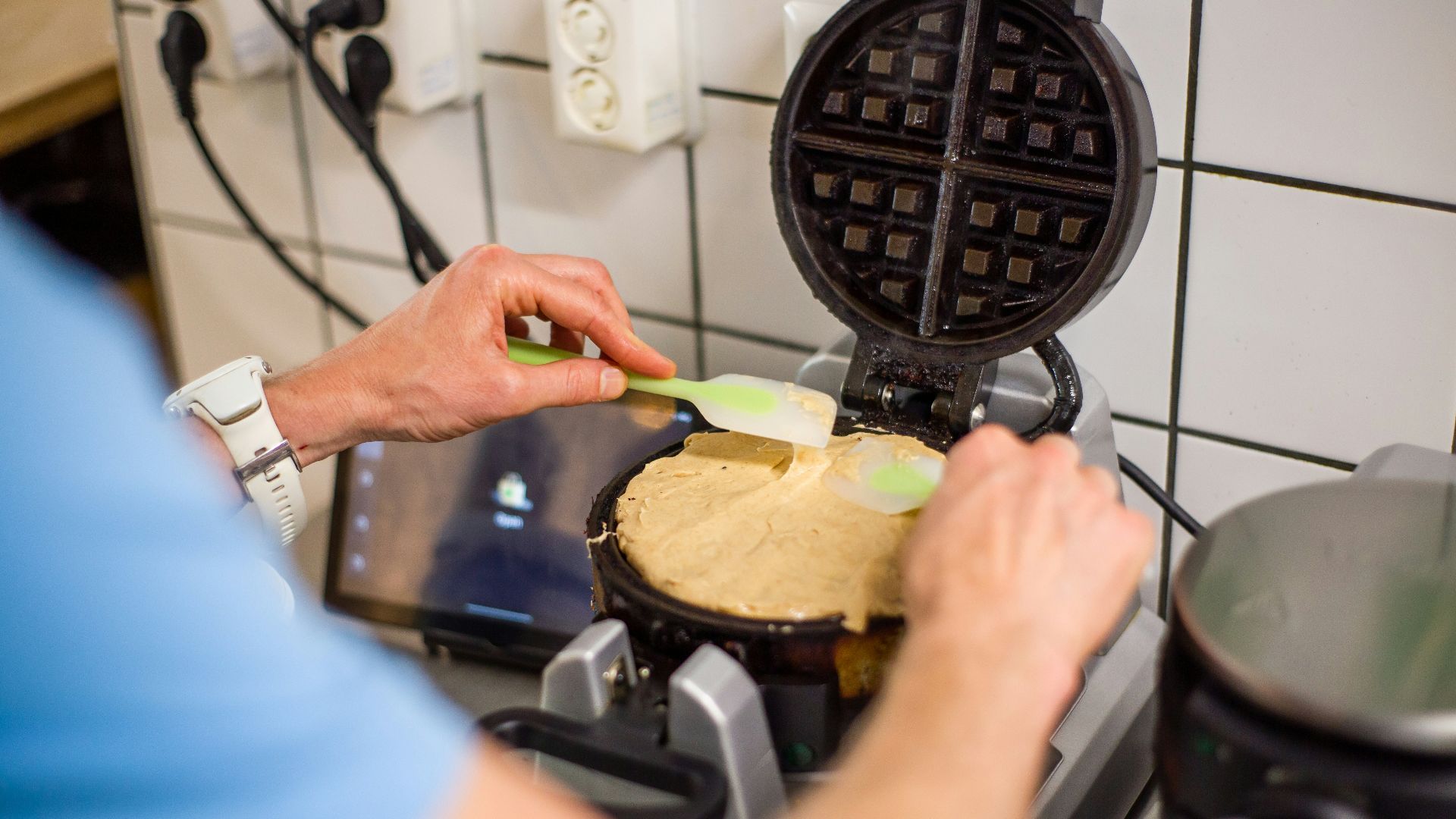 person holding a pie with cheese