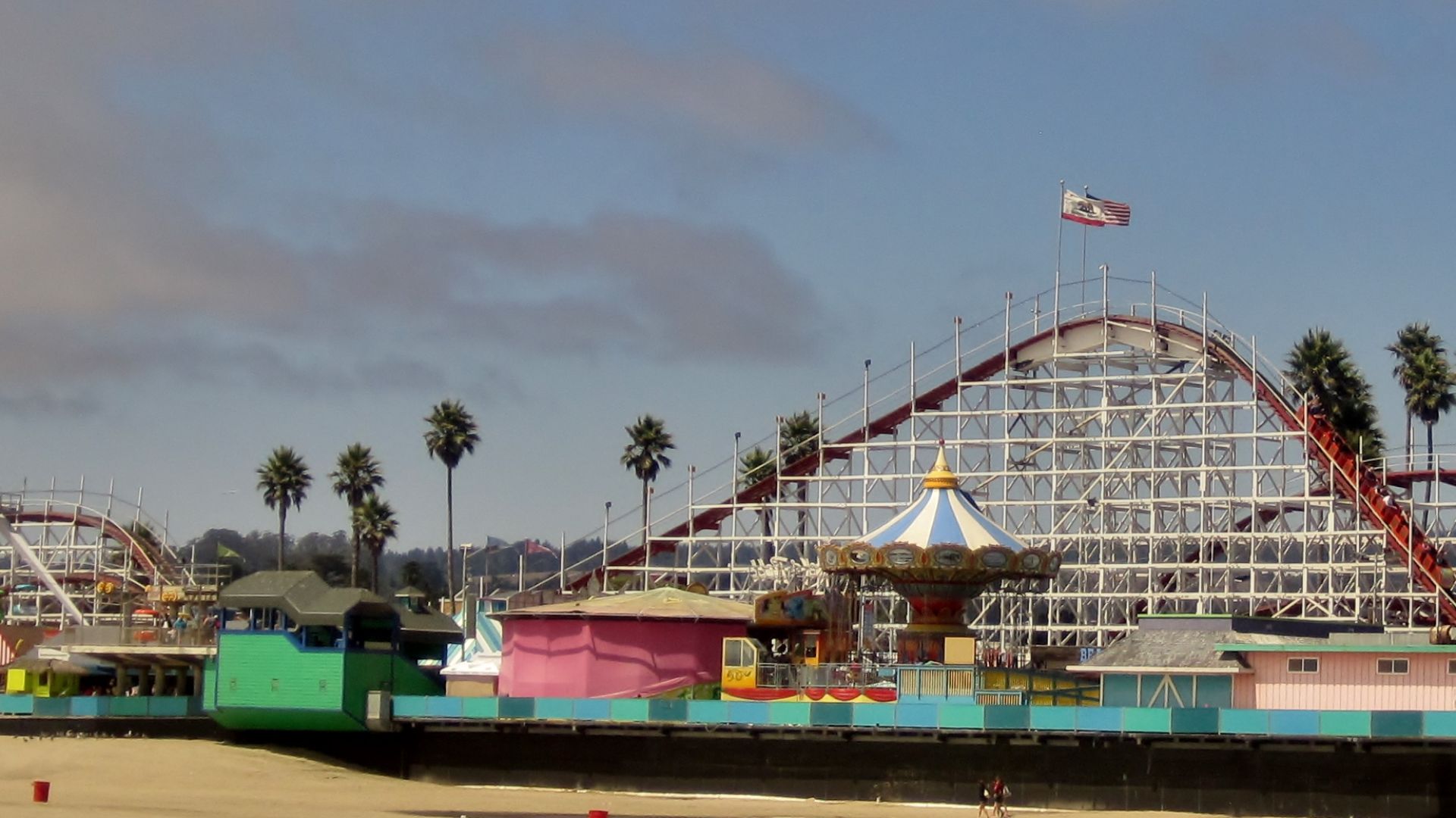 Looff Carousel and Roller Coaster on the Santa Cruz Beach Boardwalk, a national landmark (1924). The carousel was built in 1911. It features a brass ring dispenser, which riders can then take and toss at a target (a painting of a clown). It is one of five