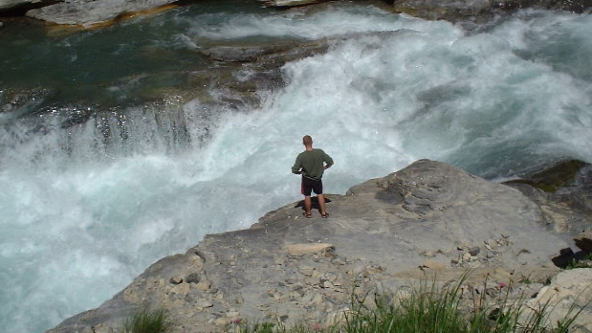 This is a rapid called 'triple step' on the river Guil in en:French Alps.
I took this photo in July 2001, while Rob Tuley stood and stared at the rapid for about 20 minutes, deciding whether he dared to kayak down it. It was extremely high water levels th