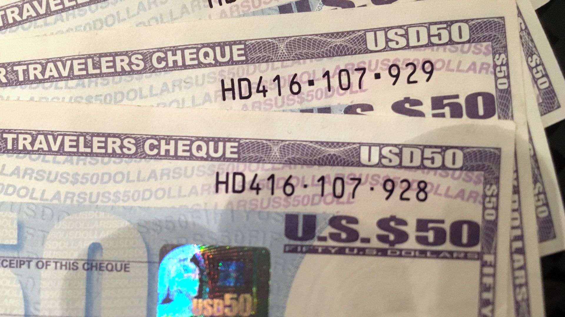 Four Travelers Cheques of 50 USD each, issued by American Express, bought ca. 2012, have long been spent. Soon after the photo was taken in 2016, they were changed back to cash.