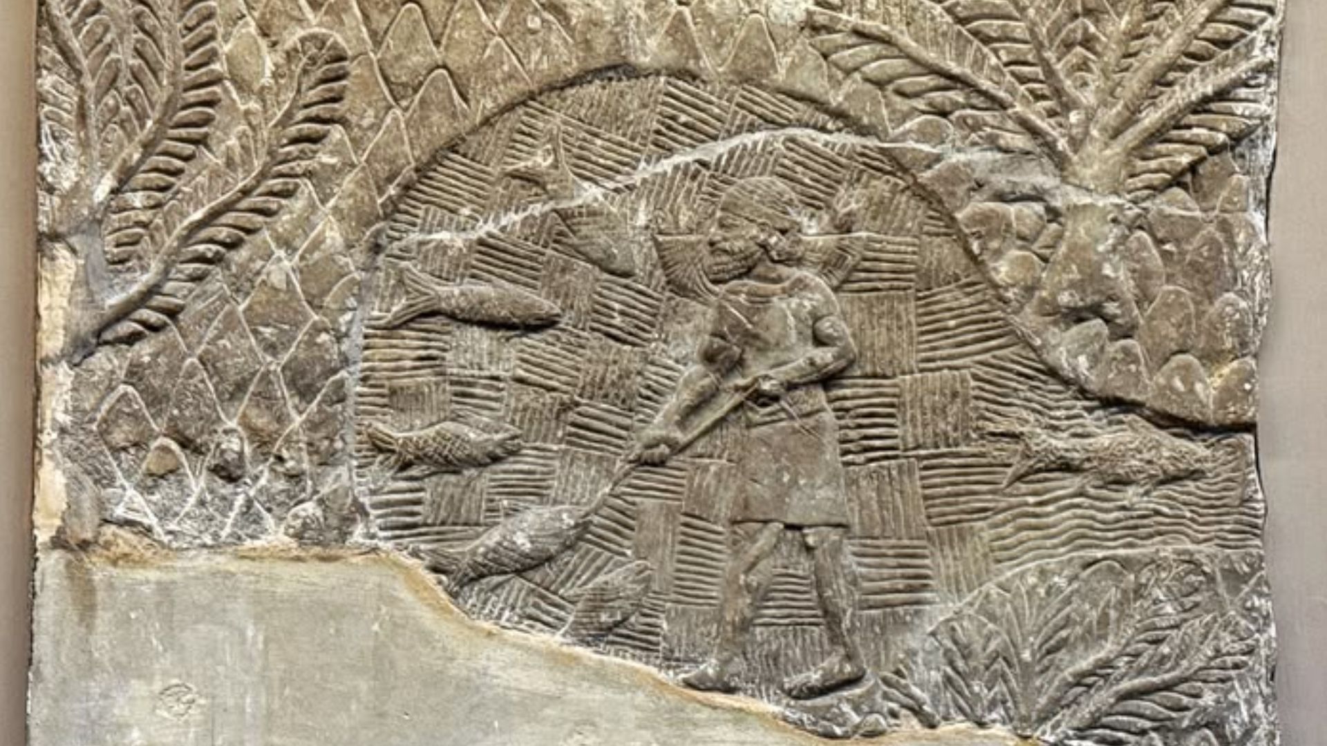 Relief showing a man fishing in a mountain pool, South West Palace, Nineveh, 700-692 BCE , Housed at the British Museum