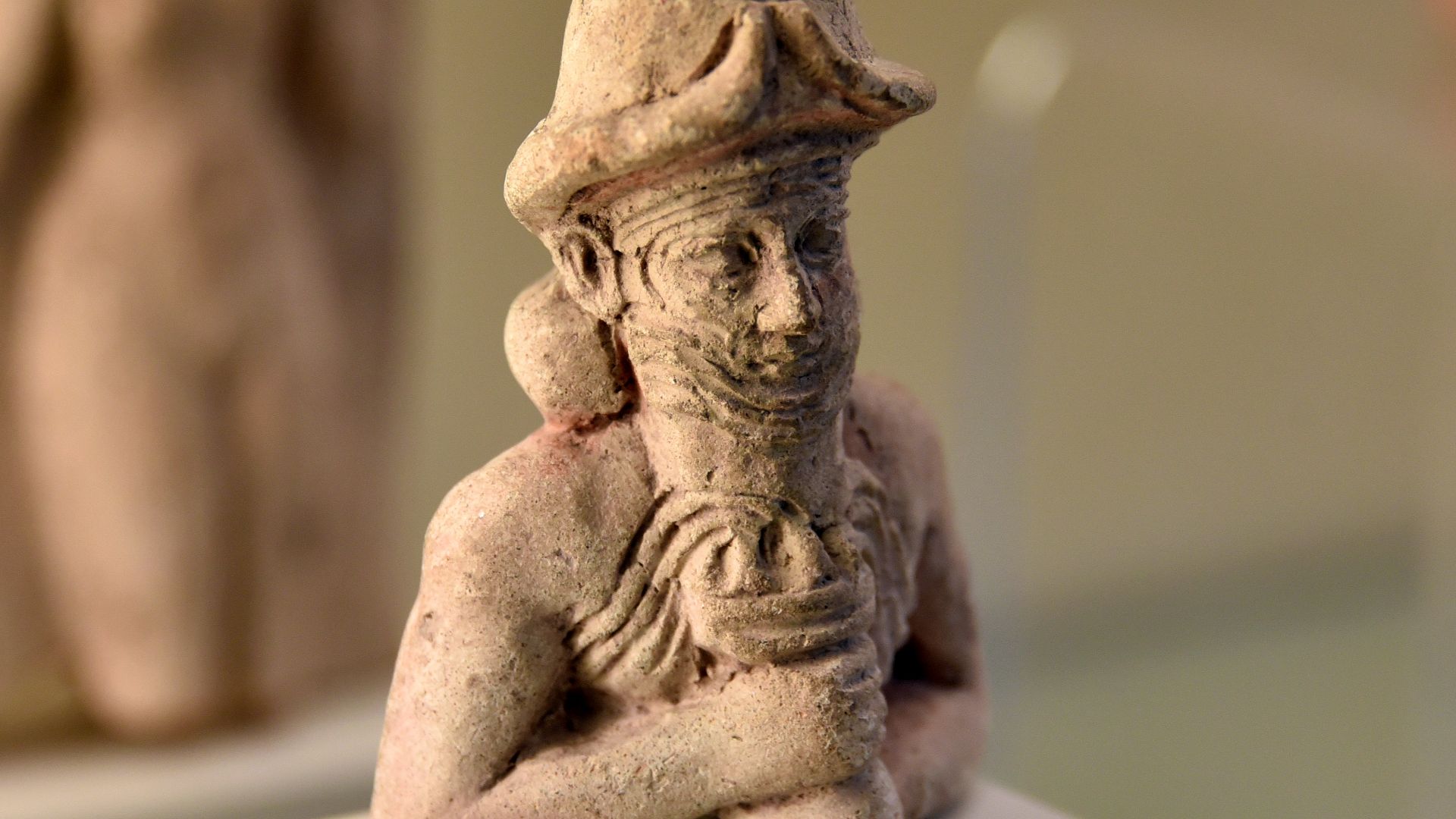 Male deity wears a horned helmet and holds a cup from which water overflows; god Ea (Enki). Nude Ishtar appears in the background. Old Babylonian period, 19th-17th century BCE. On display at the Pergamon Museum, Germany.