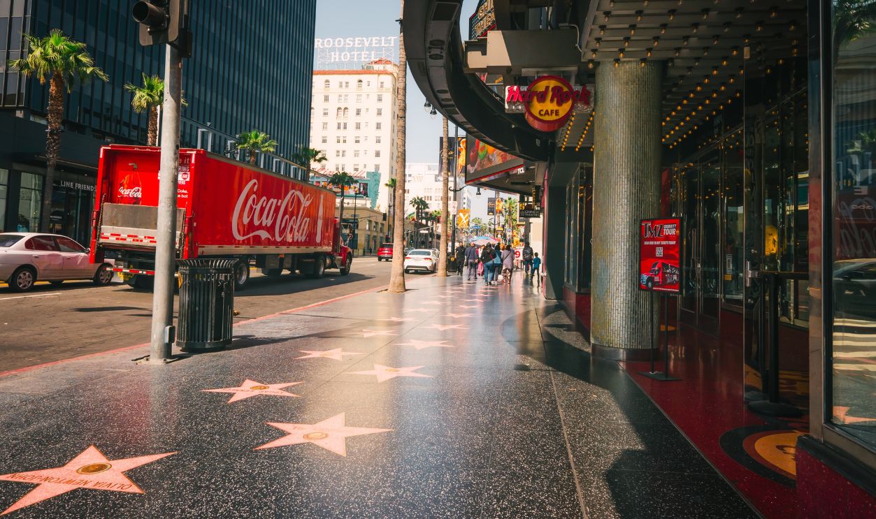 Hollywood, California, USA - April 26, 2023. Hollywood Walk of Fame. Hard Rock Cafe, stars, tourists. Architecture, city life