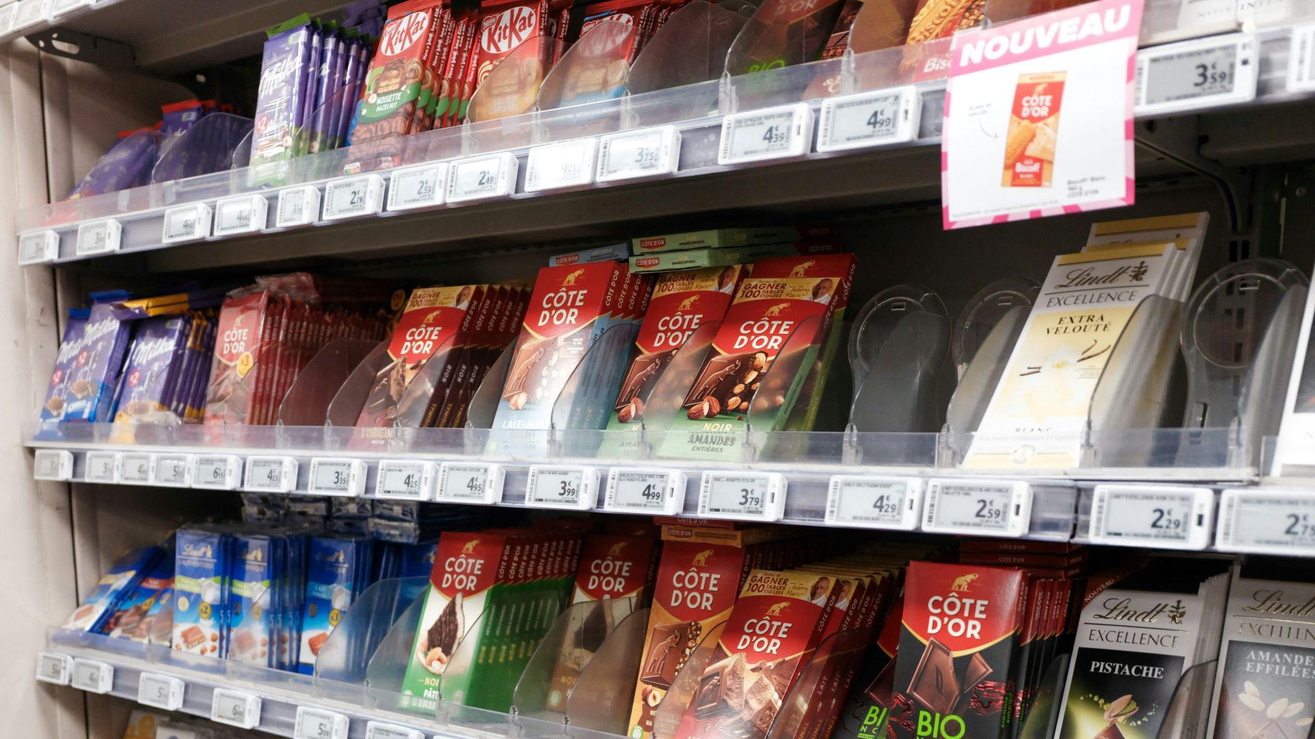Shelves filled with various chocolate bars and snacks