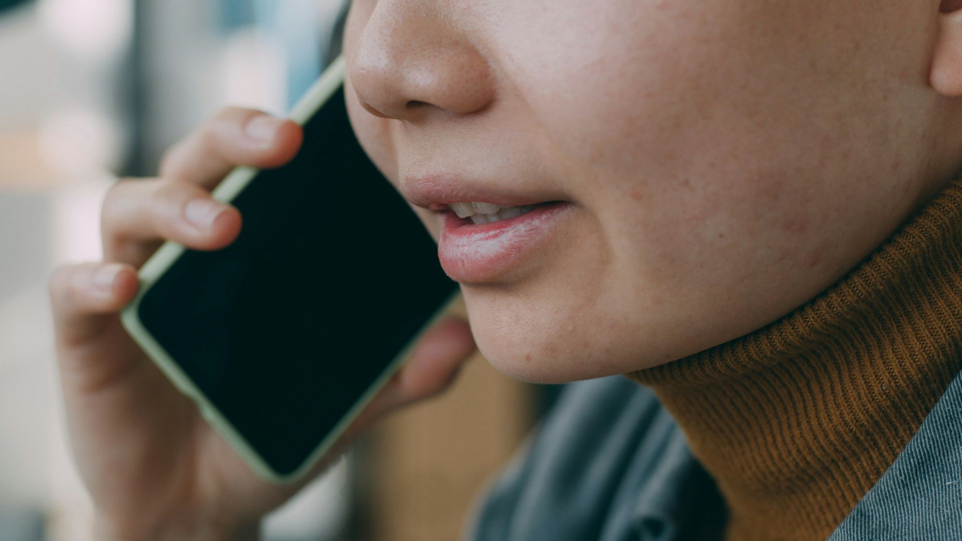 A woman is talking on a cell phone