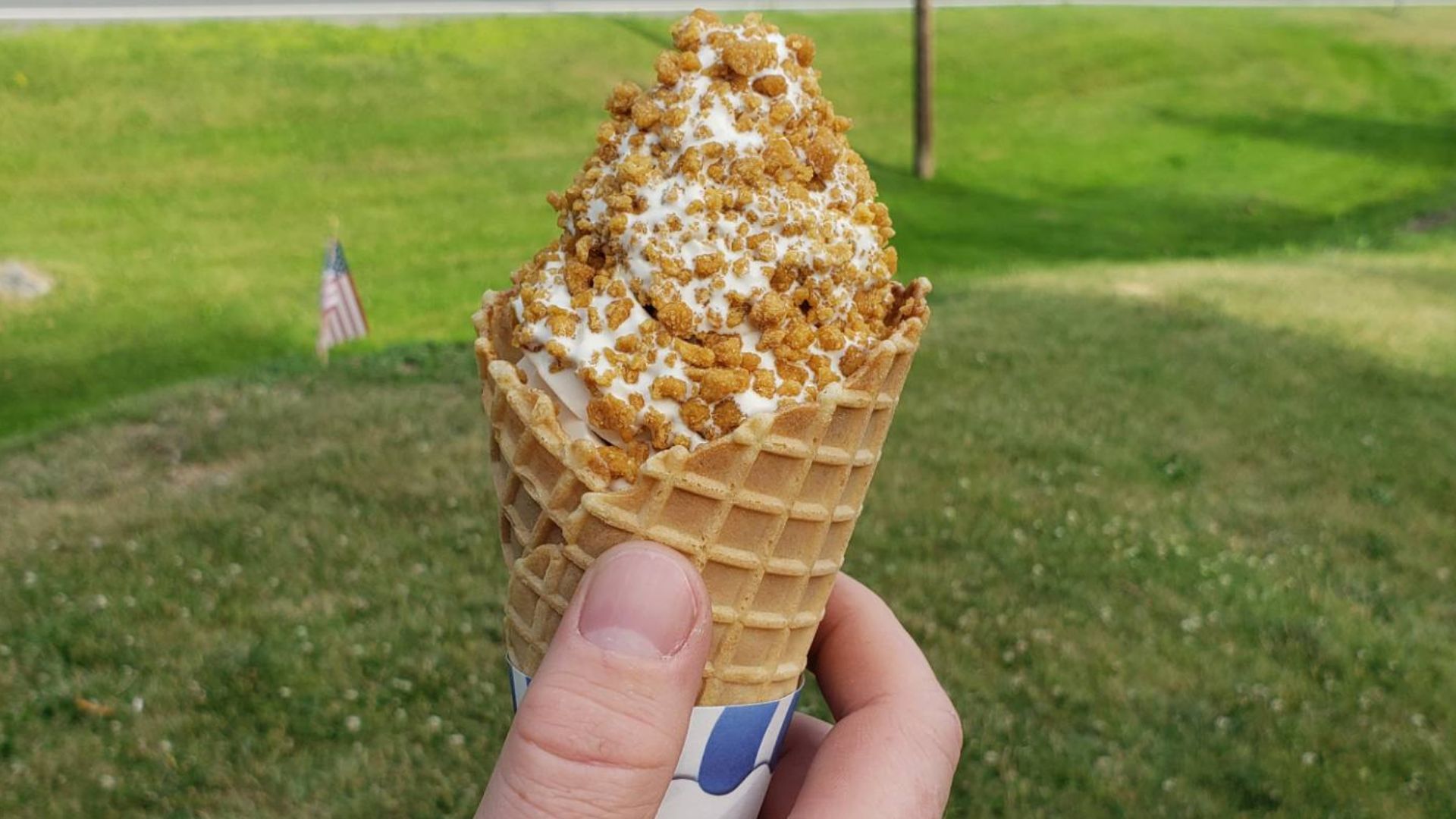 The hand of a man holding a soft-serve ice cream is known in the state of Vermont as a