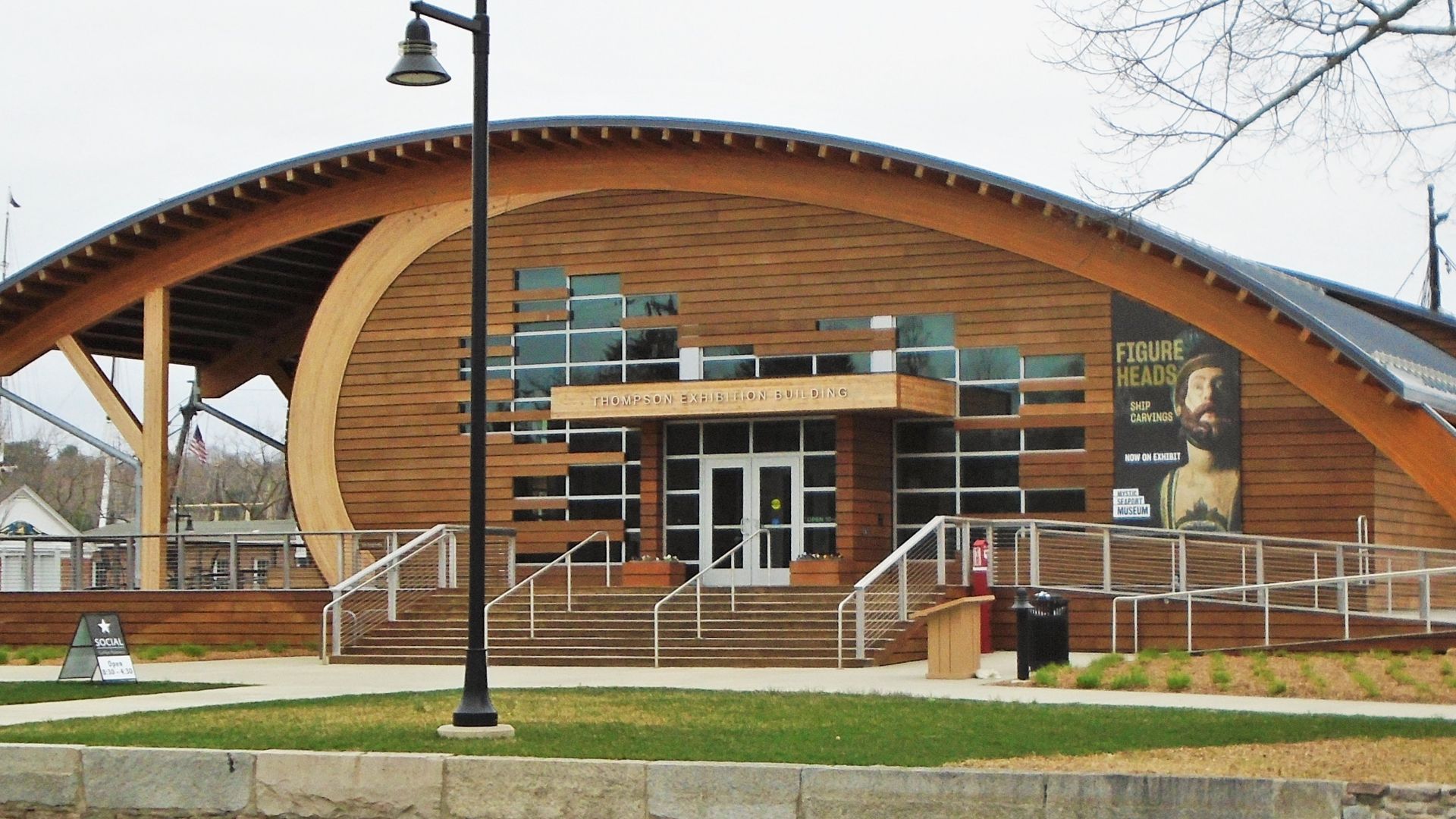 The Thompson Exhibition Building of the Mystic Seaport Museum, is located at 54 Rossie Pentway at Germanville Avenue in Mystic, Connecticut.  It was built in 2016 and was designed by Centerbrook Architects and Planners. (Sources: [1], [2])