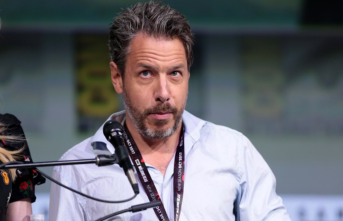 John Ross Bowie in a blue shirt