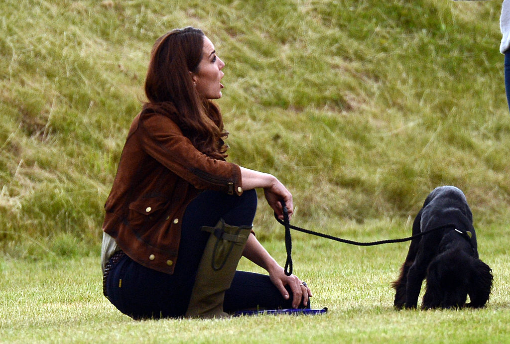 Catherine, Duchess of Cambridge relaxes with her dog Lupo