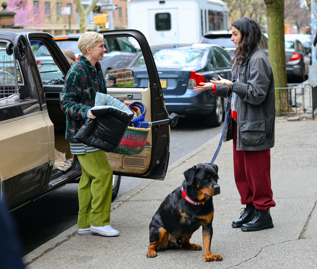 Michelle Williams and Jenny Slate with her dog at the film set of the 'Dying for Sex'