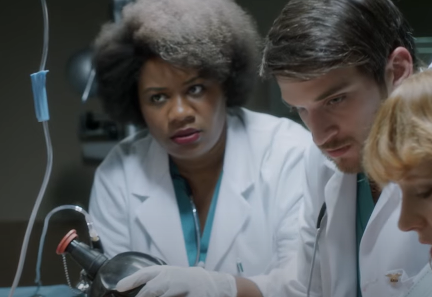 Screenshot of The Lennon Report (2016) showing doctors trying to save  John Lennon's life