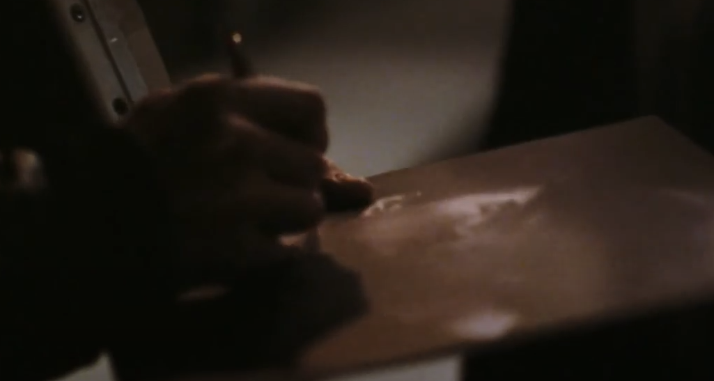 actor that plays John Lennon signs an album 