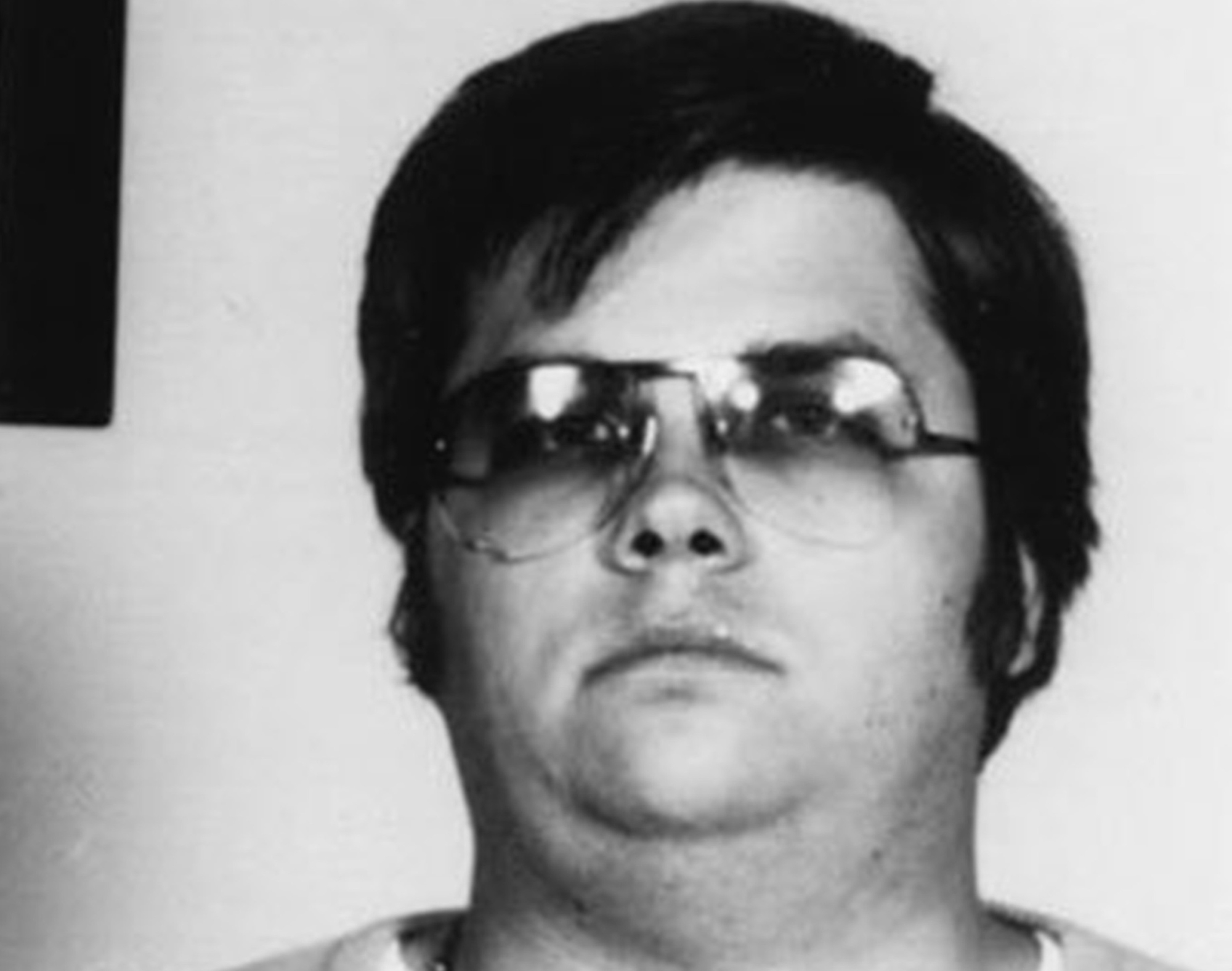 Mark David Chapman poses for a mugshot