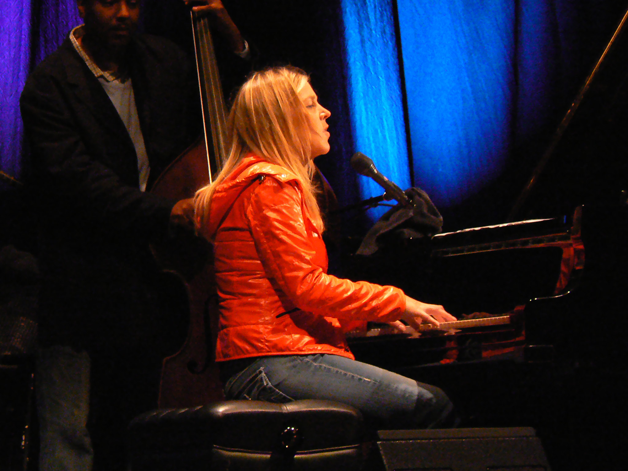 Diana Krall in orange winter jacket