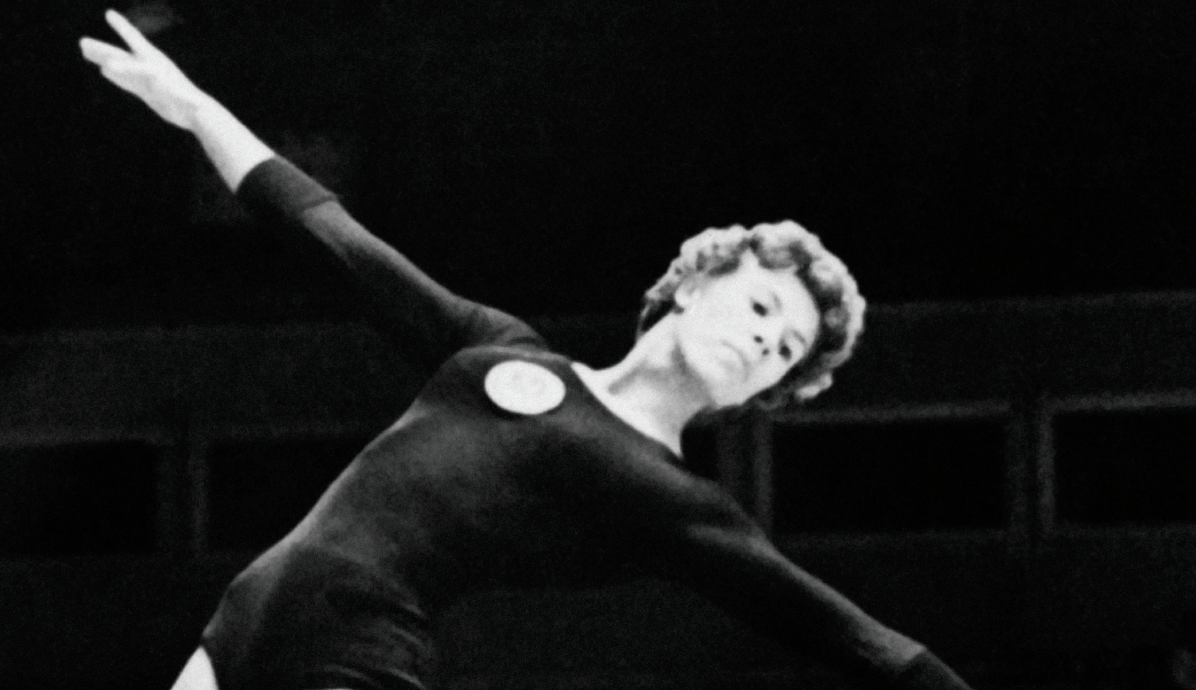 Soviet Larissa Latynina performing her routine on the beam