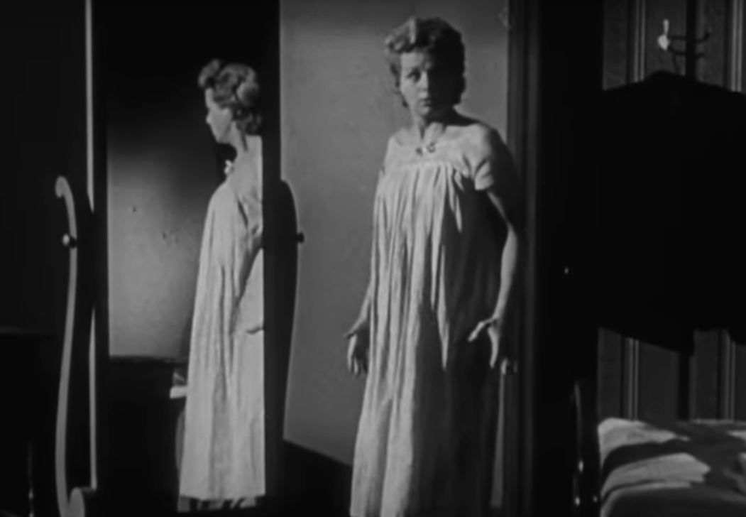 A screenshot of the movie The Night of the Hunter