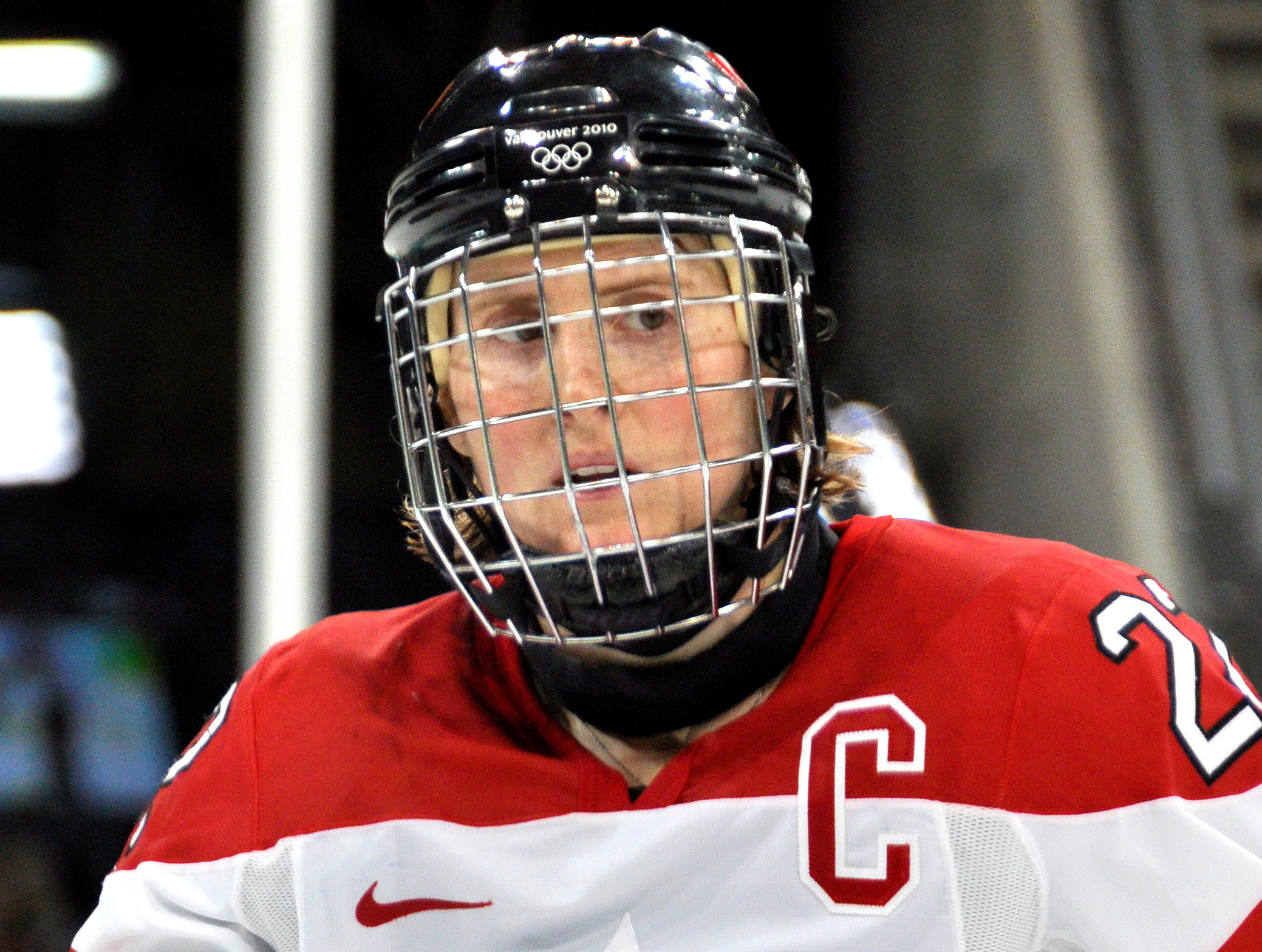 Hayley Wickenheiser in red jersey and helmet