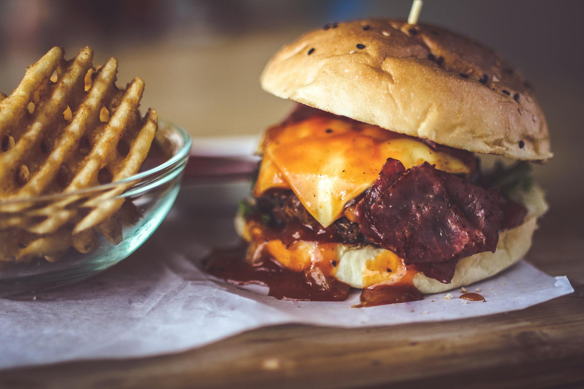 closeup image of burger on wooden table