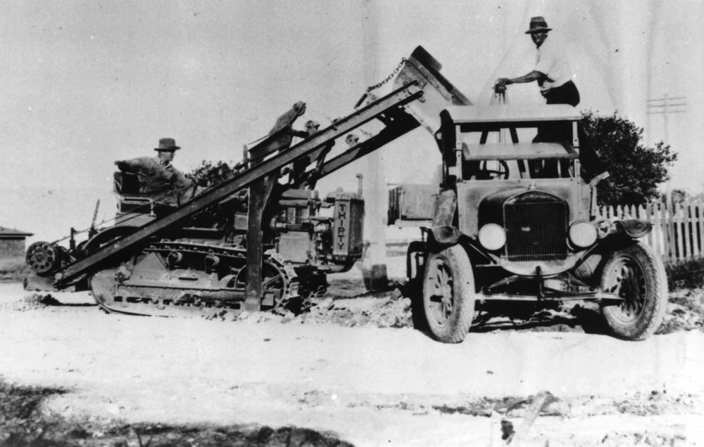 Ford Model T, one ton truck with a Caterpillar earthmover, ca. 1925