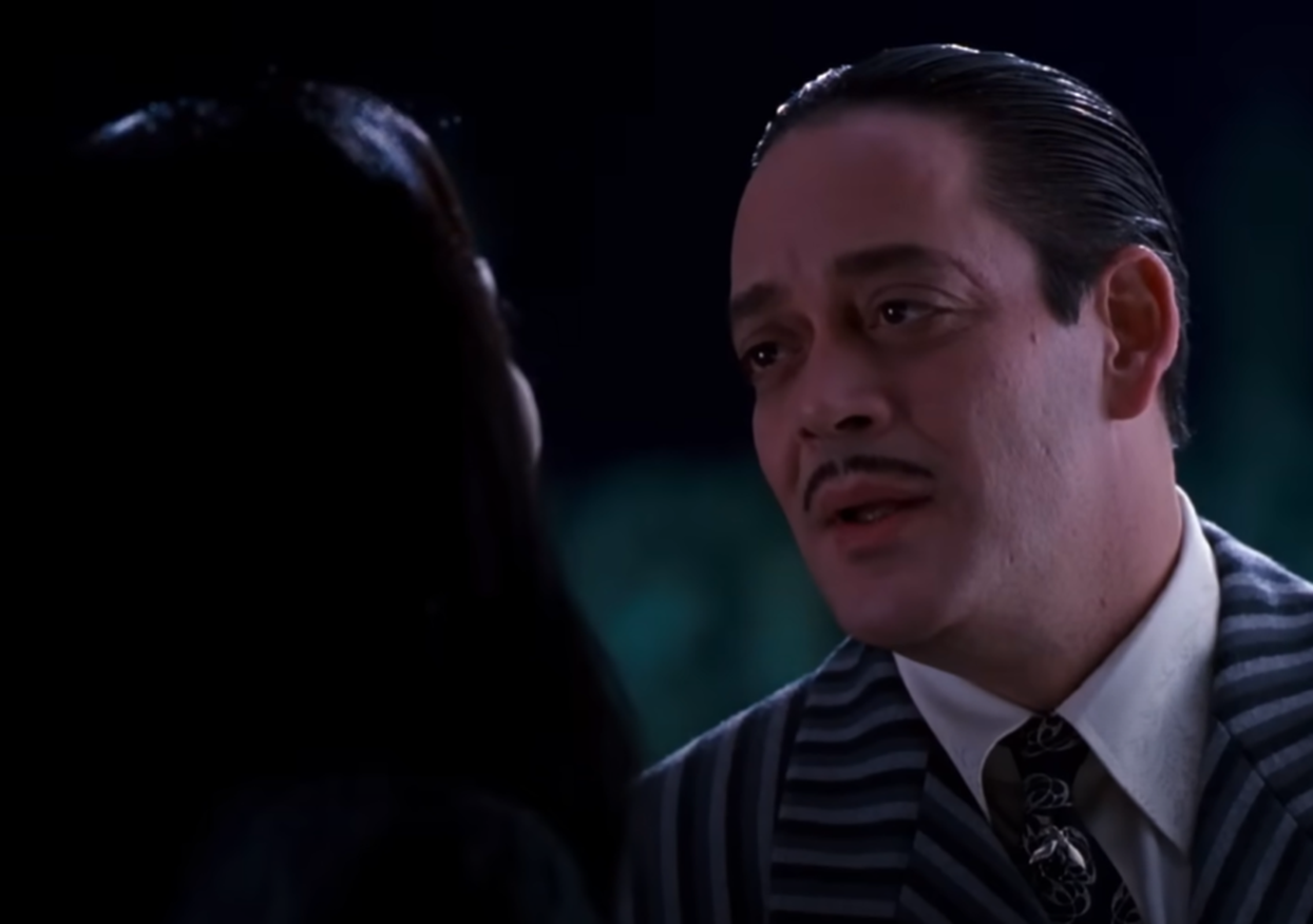 Screenshot of Anjelica Huston & Raul Julia from - The Addams Family (1991)