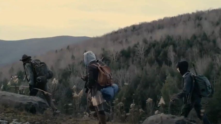 Group of people running away from vampires