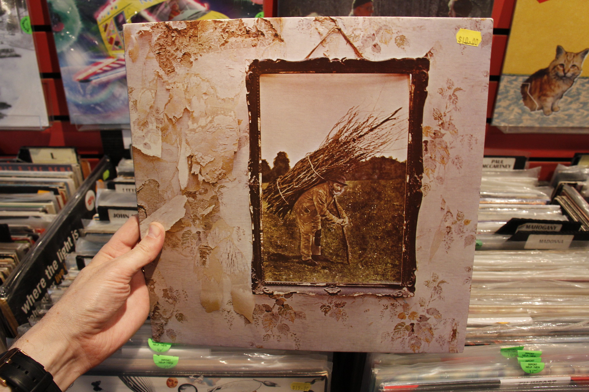 Person holding Led Zeppelin IV album