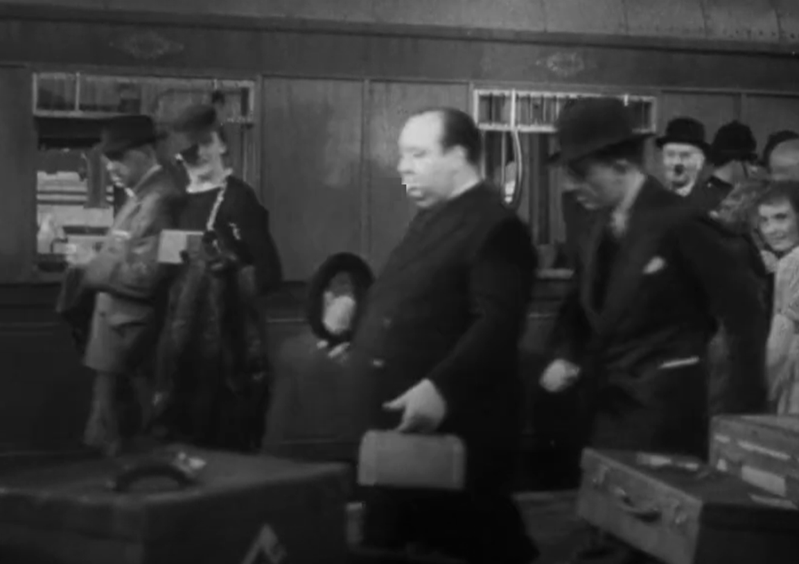 Screenshot of Alfred Hitchcock from - The Lady Vanishes (1938)