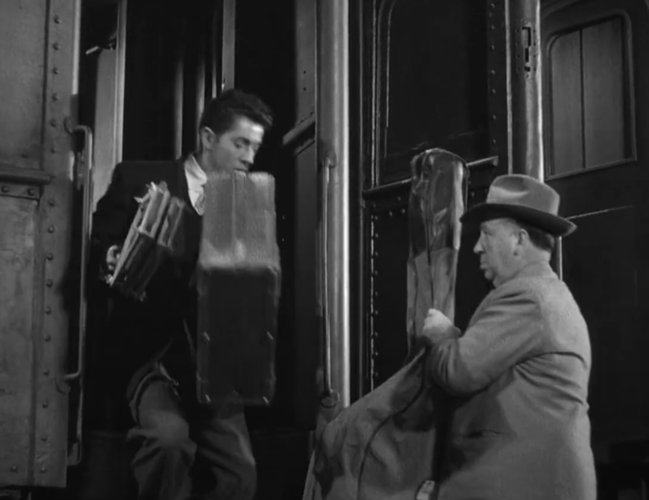 Screenshot of Alfred Hitchcock from - Strangers on a Train (1951)