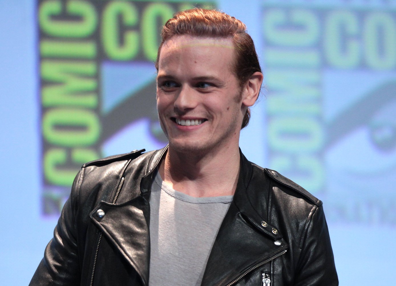 Sam Heughan in a black leather jacket