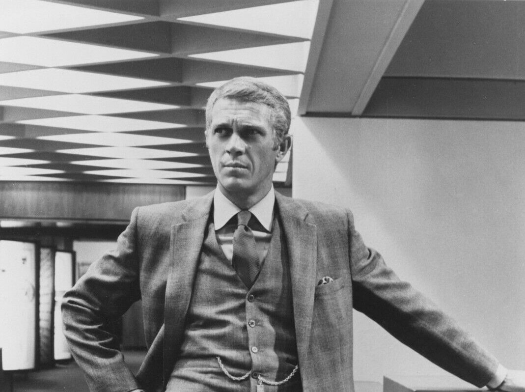 Grayscale Portrait Photo of Steve McQueen in a gray suit