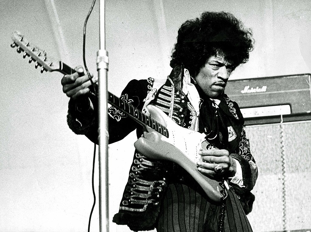 Grayscale Portrait Photo of Jimi Hendrix Performing in Sweden