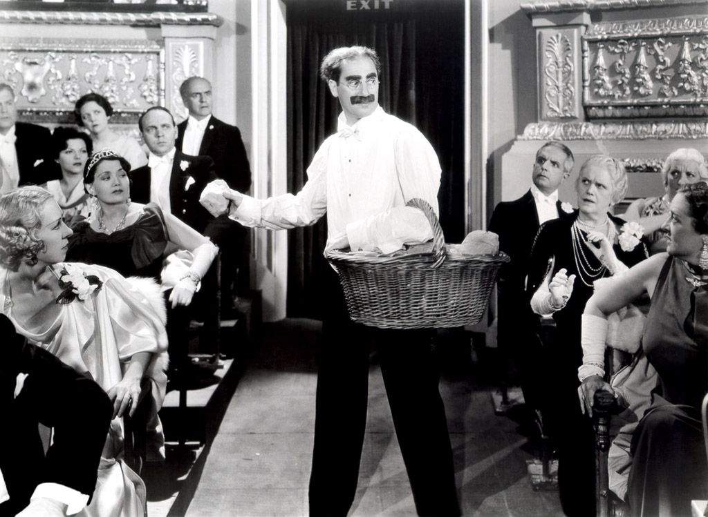 Groucho Marx carrying a basket