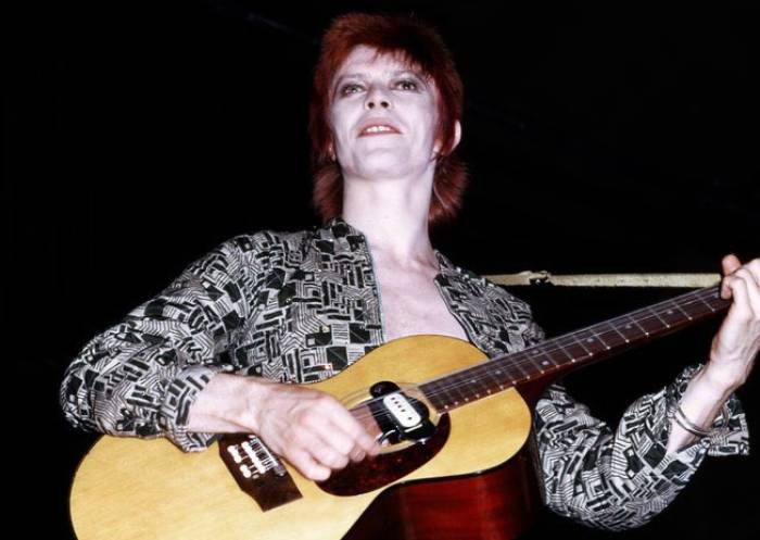 David Bowie in colorful Jumpsuit  performing