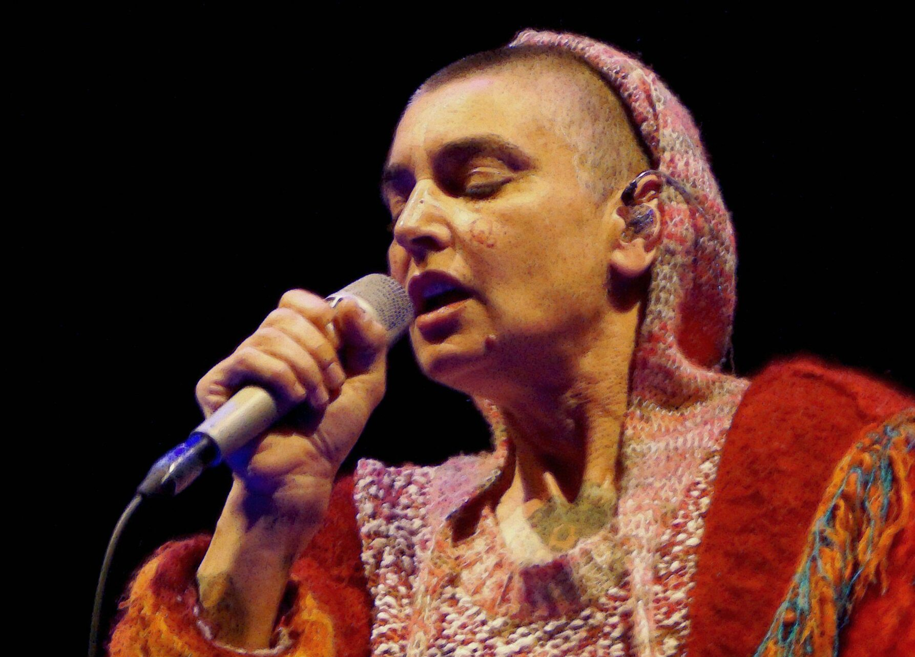 Sinéad O'Connor performing at a festival