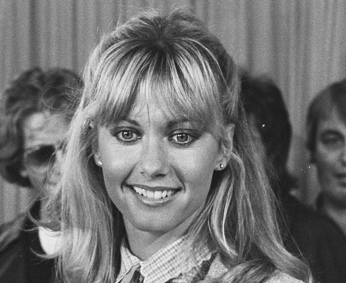 Grayscale Portrait Photo of Olivia Newton John smiling
