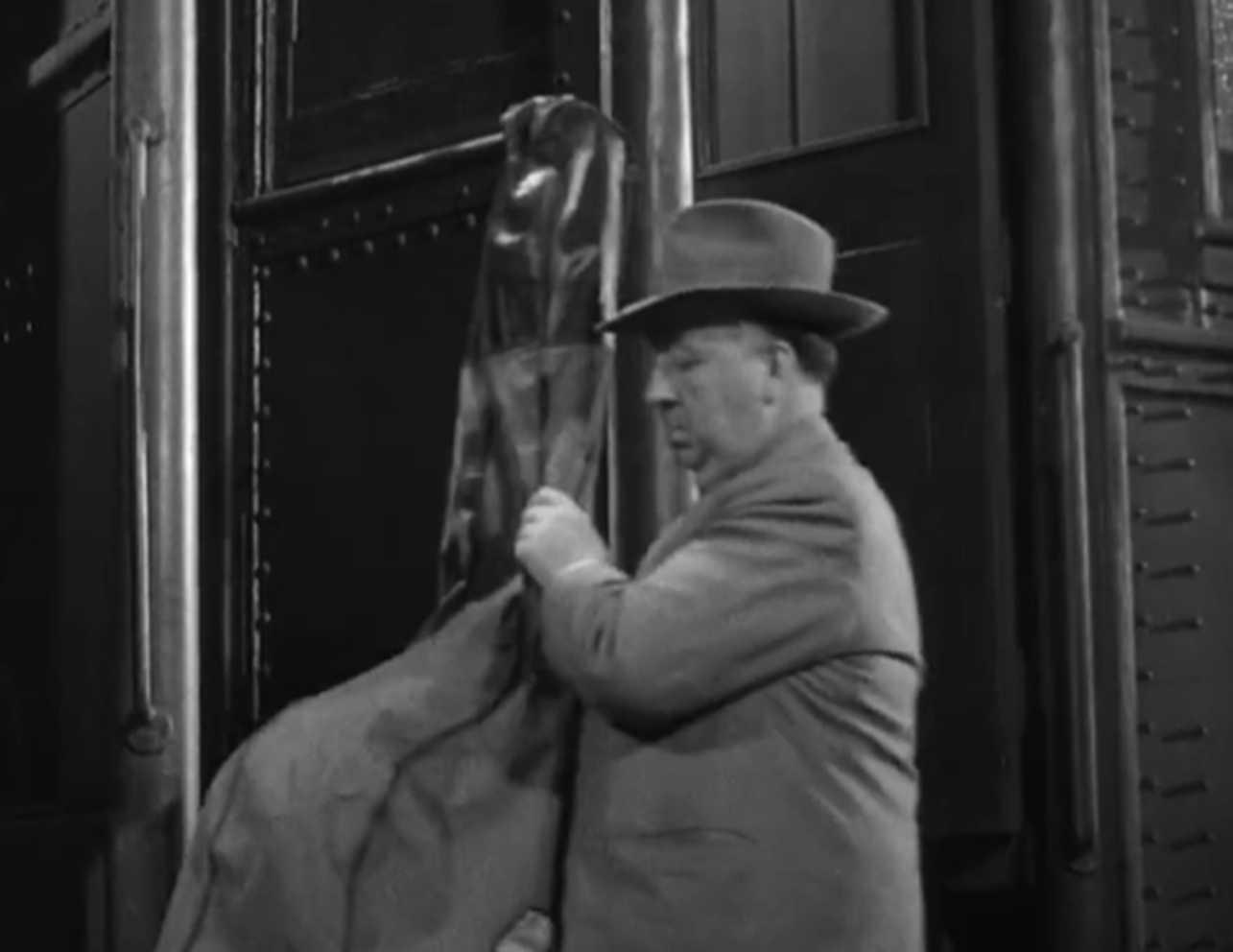 Screenshot of Alfred Hitchcock from - Strangers on a Train (1951)