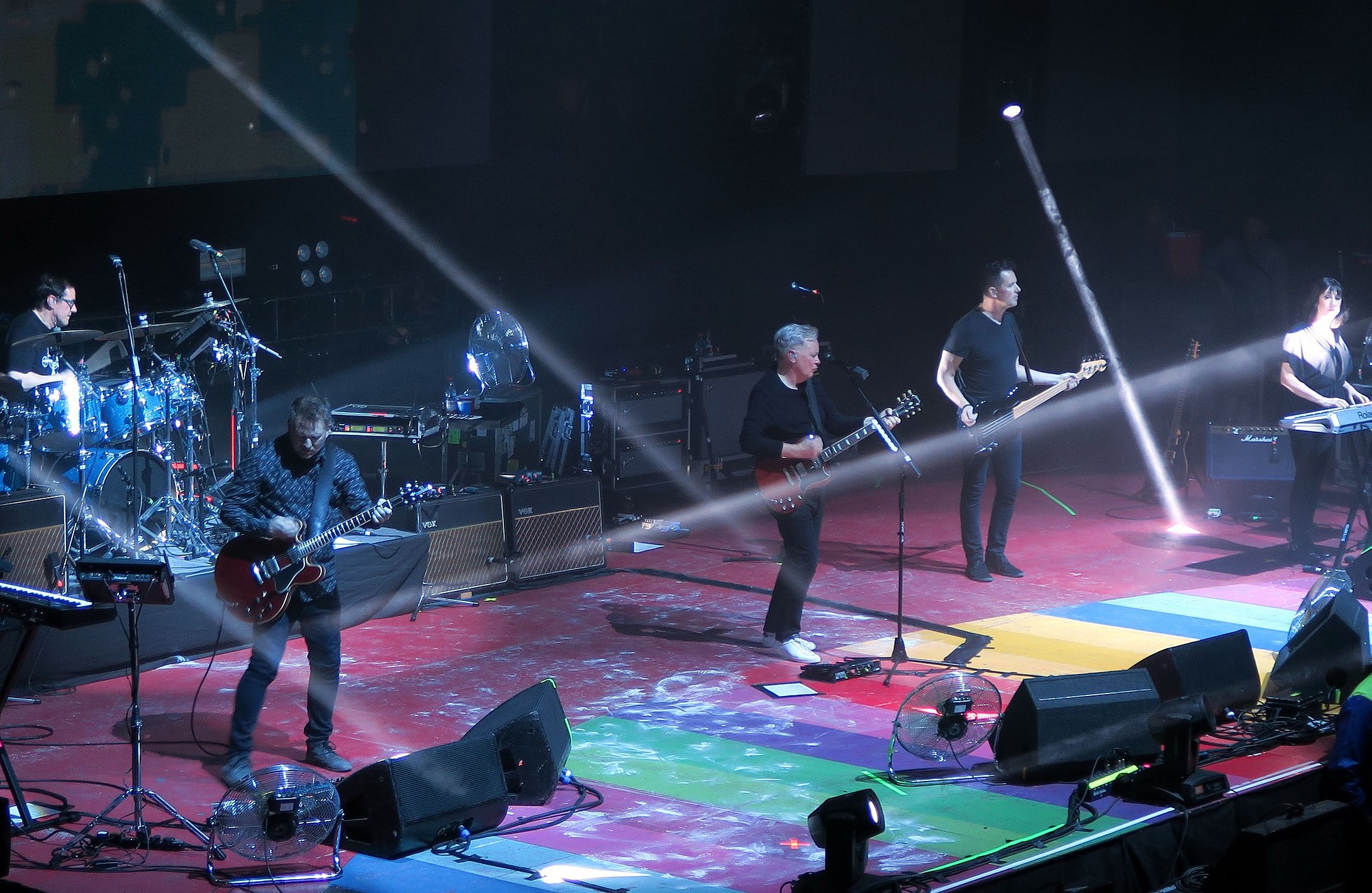 New Order performing on-stage in Chile, 2019