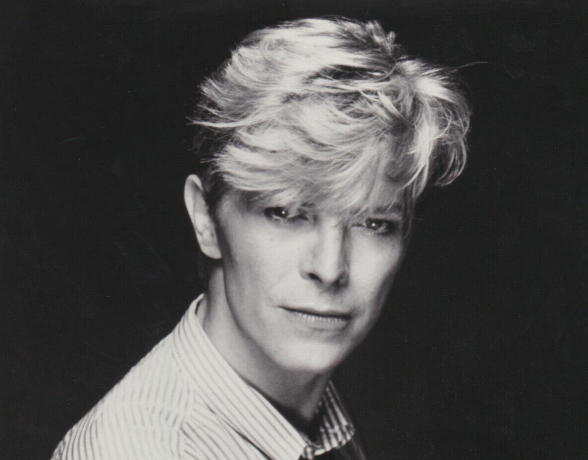 Grayscale Portrait Photo of David Bowie in a white shirt
