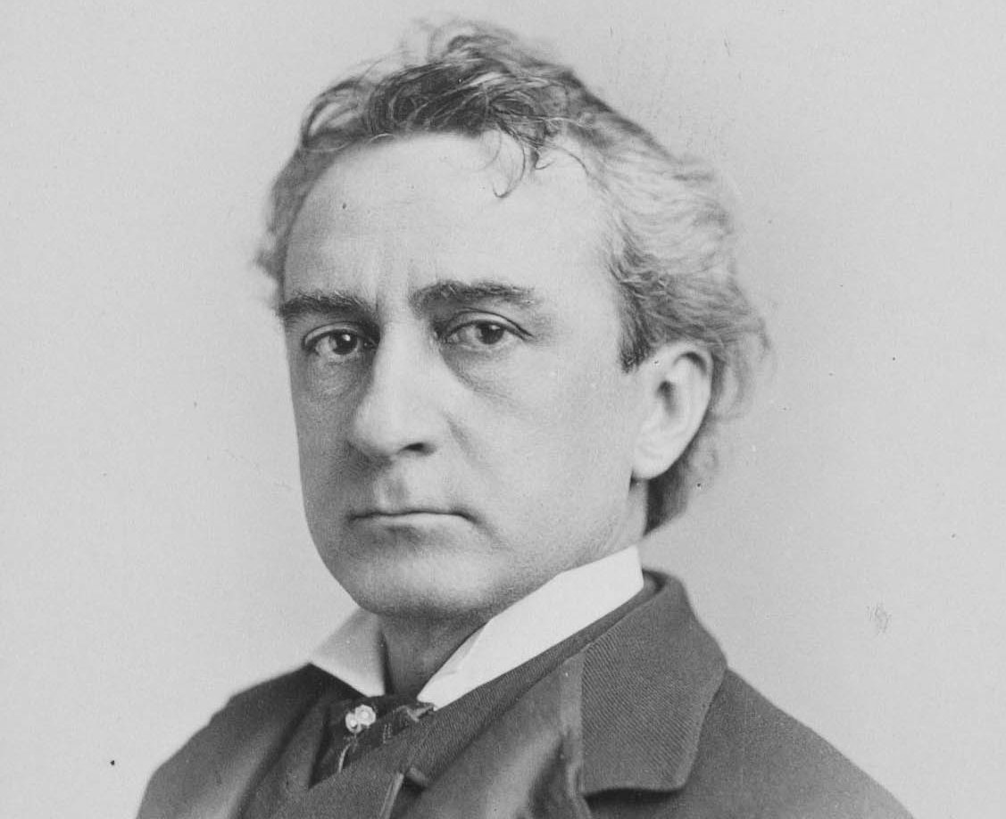 Grayscale Portrait Photo of The American actor Edwin Booth in a gray suit