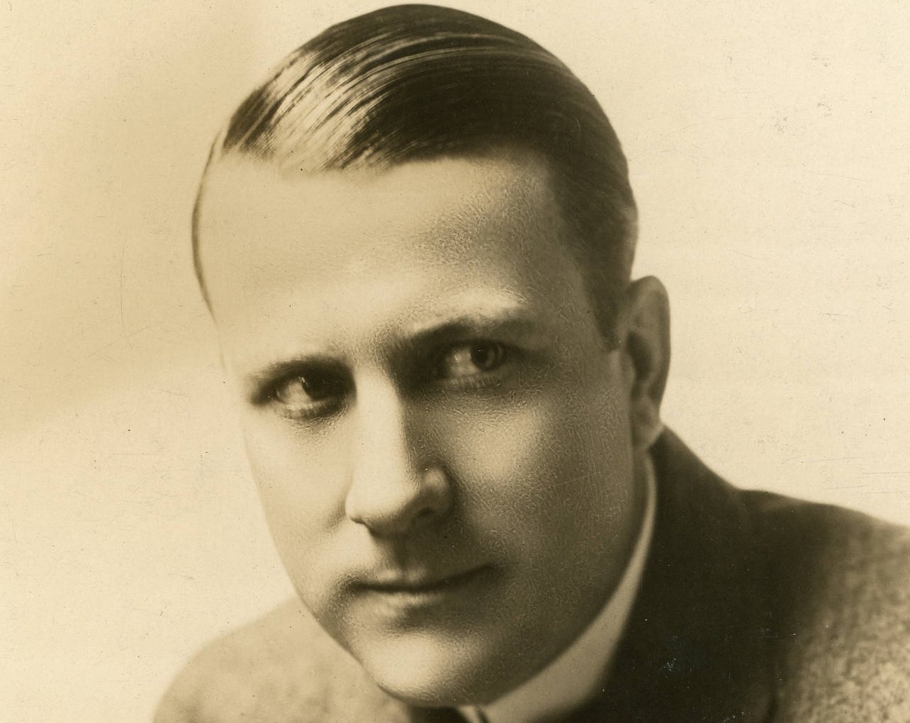 Grayscale Portrait Photo of William King Baggot in gray suit