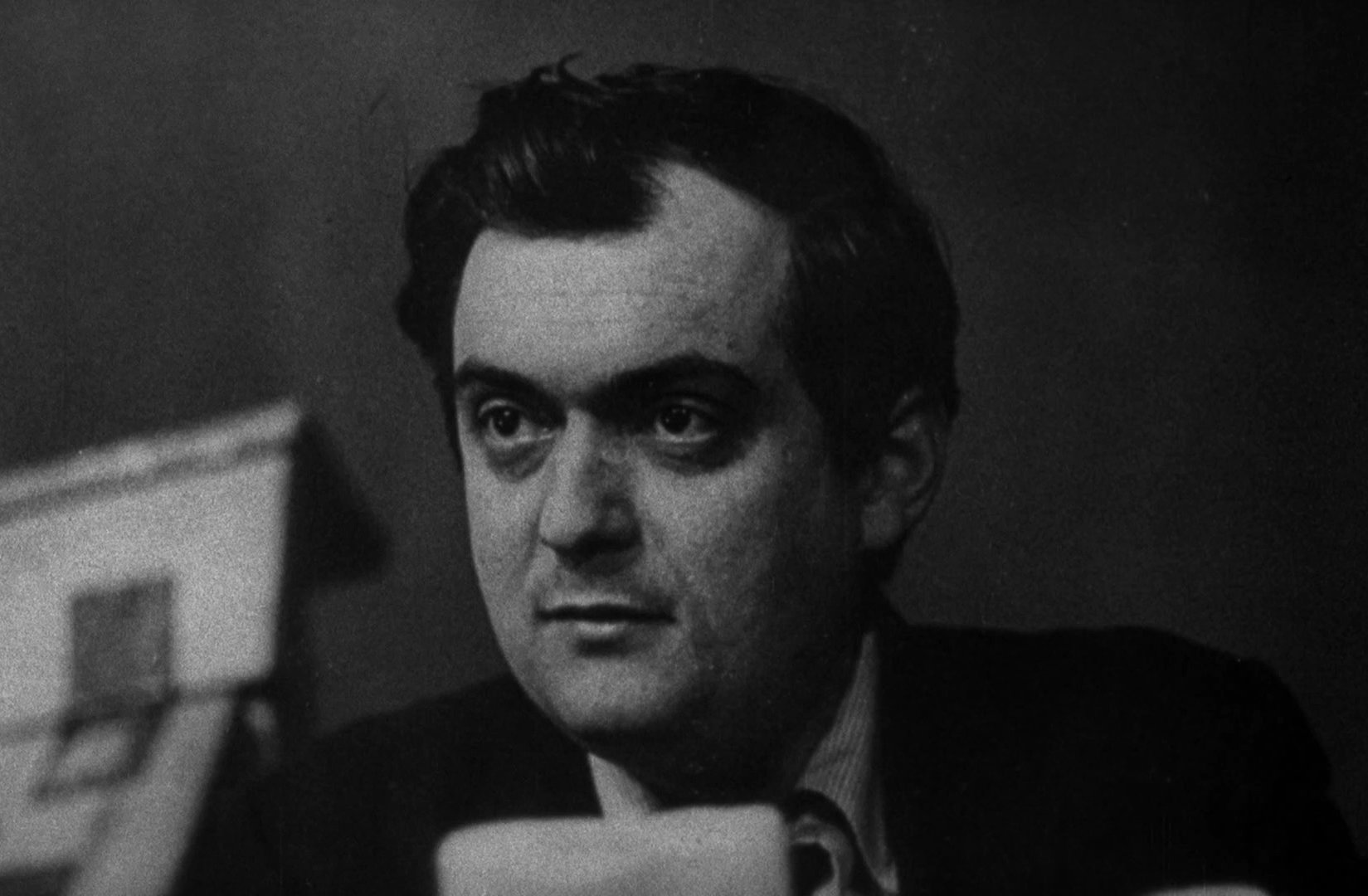 Grayscale Portrait Photo of Film director Stanley Kubrick in dark suit
