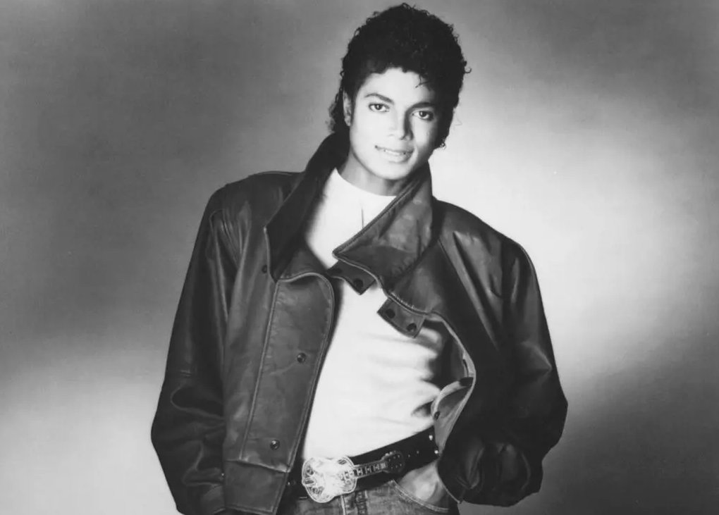 Grayscale Portrait Photo of Michael Jackson in a black jacket and white shirt
