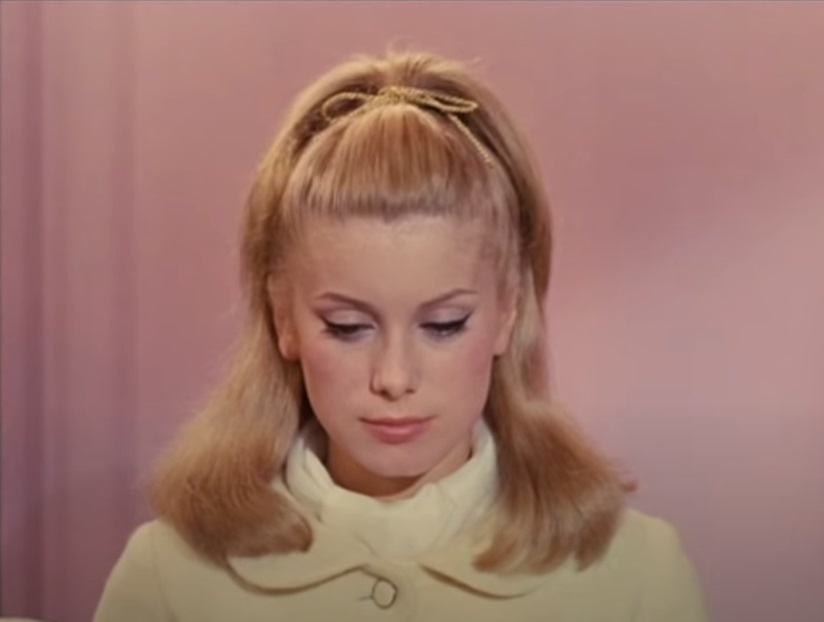 A visually captivating still taken from a pivotal moment in the film The Umbrellas of Cherbourg (1964)