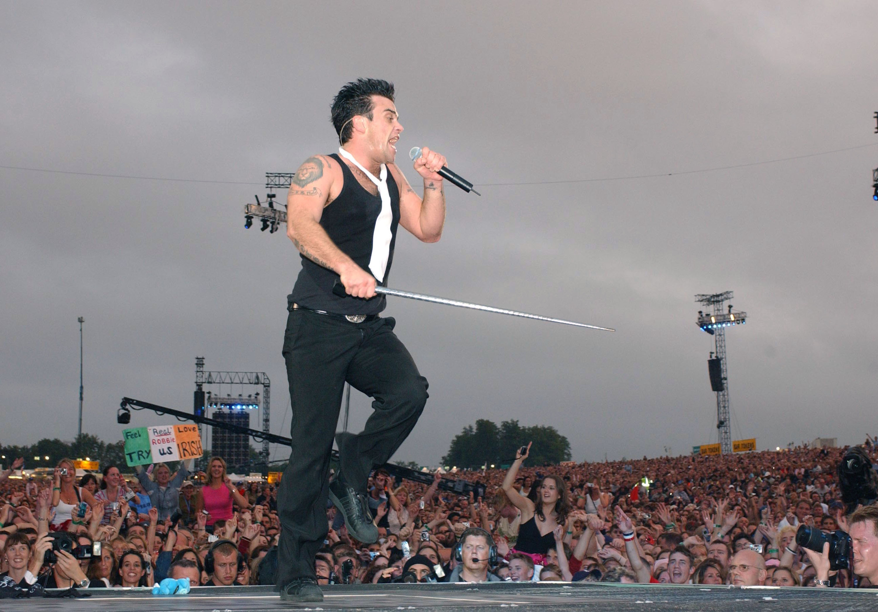 Singer Robbie Williams performs at Knebworth Park