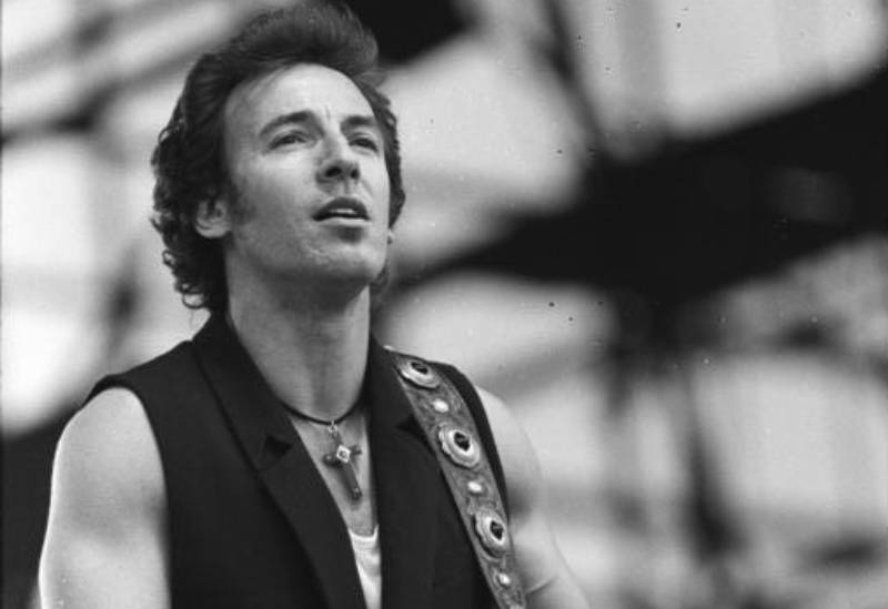 Bruce Springsteen performing on stage