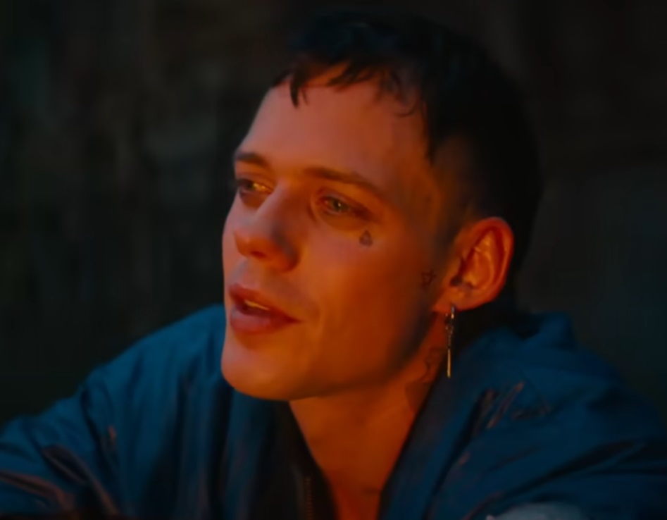 A visually captivating still taken from a pivotal moment in the film The Crow (2024), Bill Skarsgård as Eric Draven