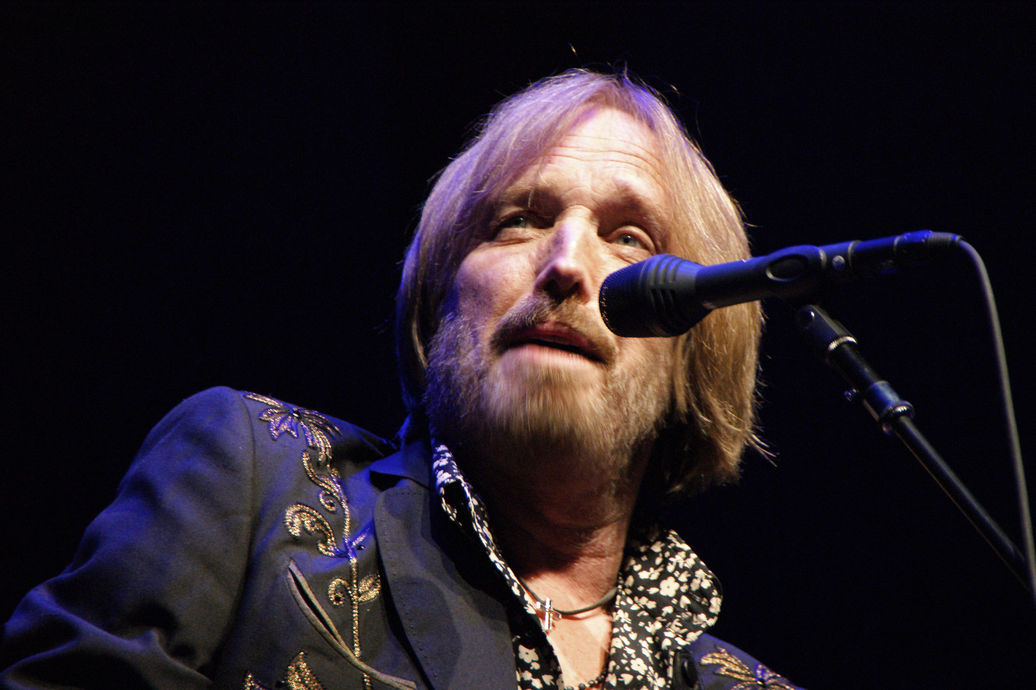 Tom Petty performing on stage