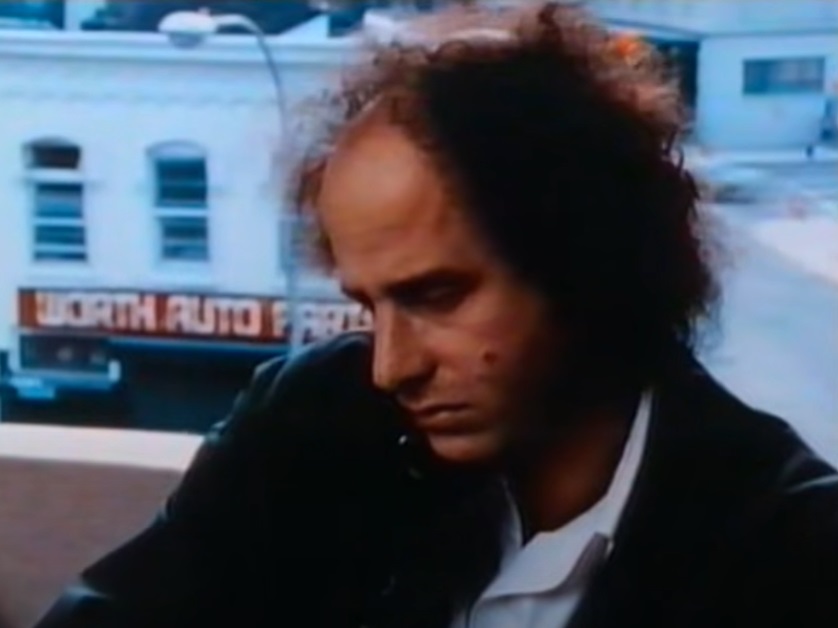 A visually captivating still taken from a pivotal moment in the film The Appointments of Dennis Jennings (1988)