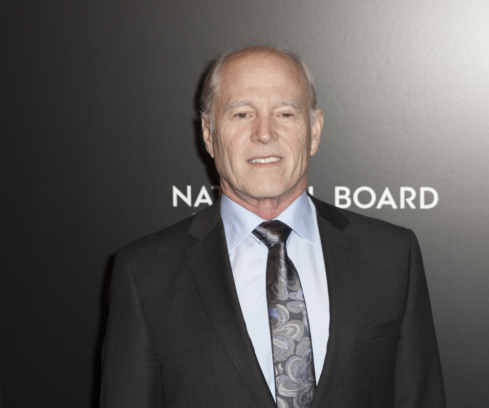 Frank Marshall in suit looking at the camera